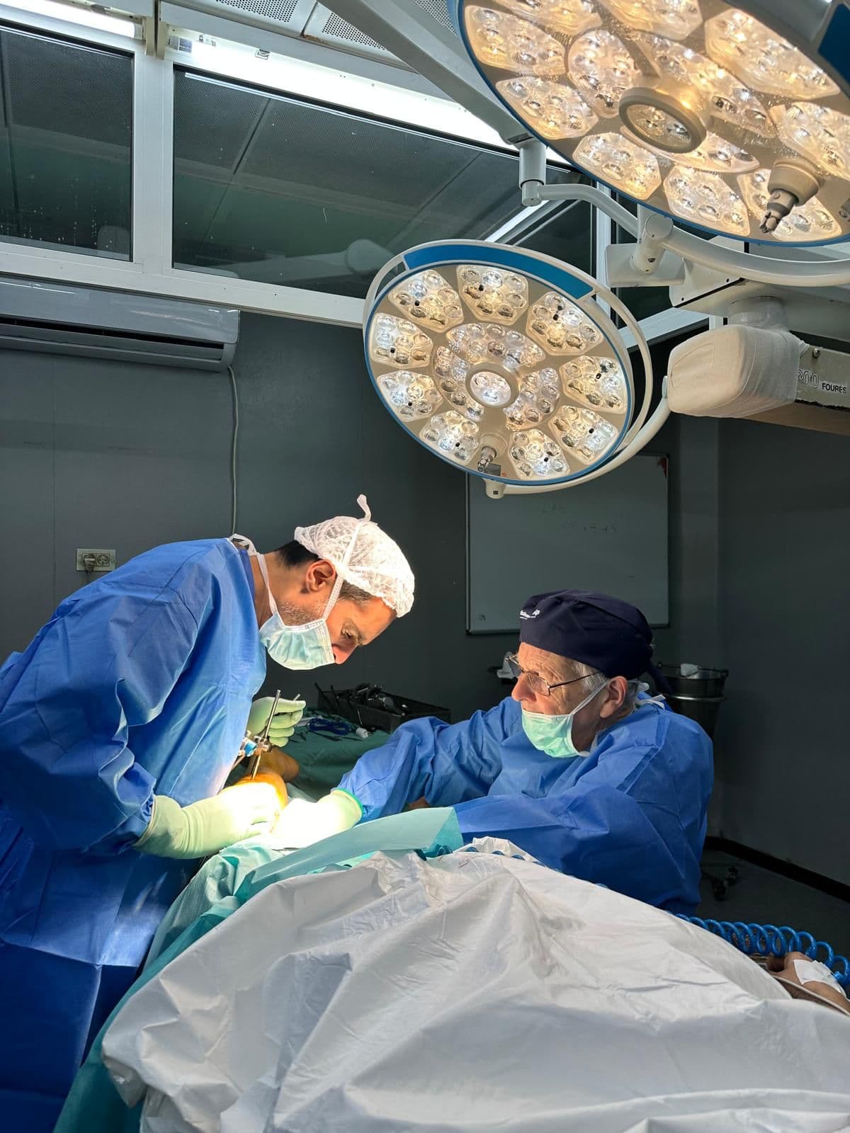 Surgeons operating in a theatre