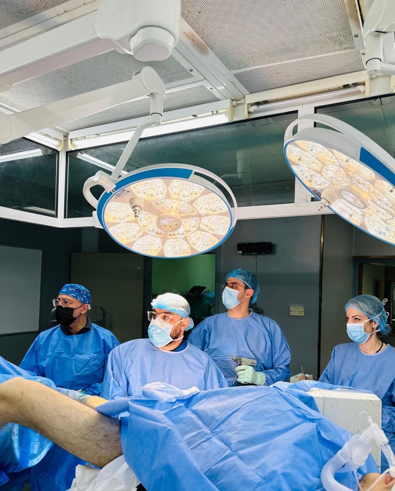 Surgical team standing together in an operating theatre