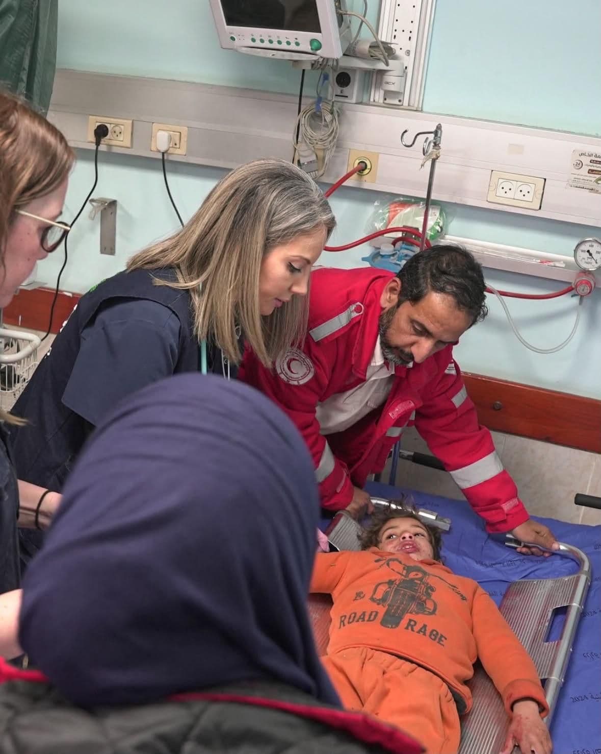 Medical team caring for a child on a stretcher